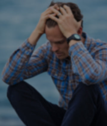 Man reflecting anxiety, showing relief potential from CBD and THC products.