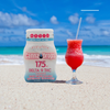 CannaDrops Delta 9 THC beverage enhancer on tropical beach next to fruity red cocktail – 175mg fast-acting flavorless THC drops for summer drinks.