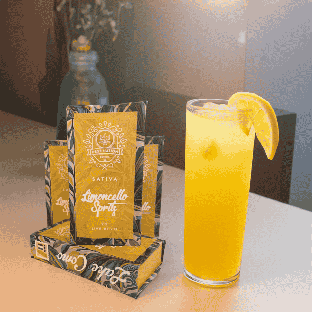Glass of yellow lemonade with a lemon wedge next to packages of 'Lime & Lemon' product on a table.