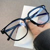 Black unisex blue light blocking glasses with anti-glare lenses for screen use.
