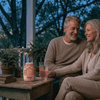 couple sitting outside drinking thc drink drops for fun
